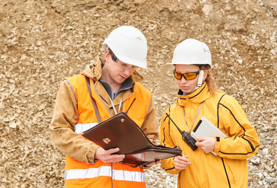 Mining professionals collaborating at a site